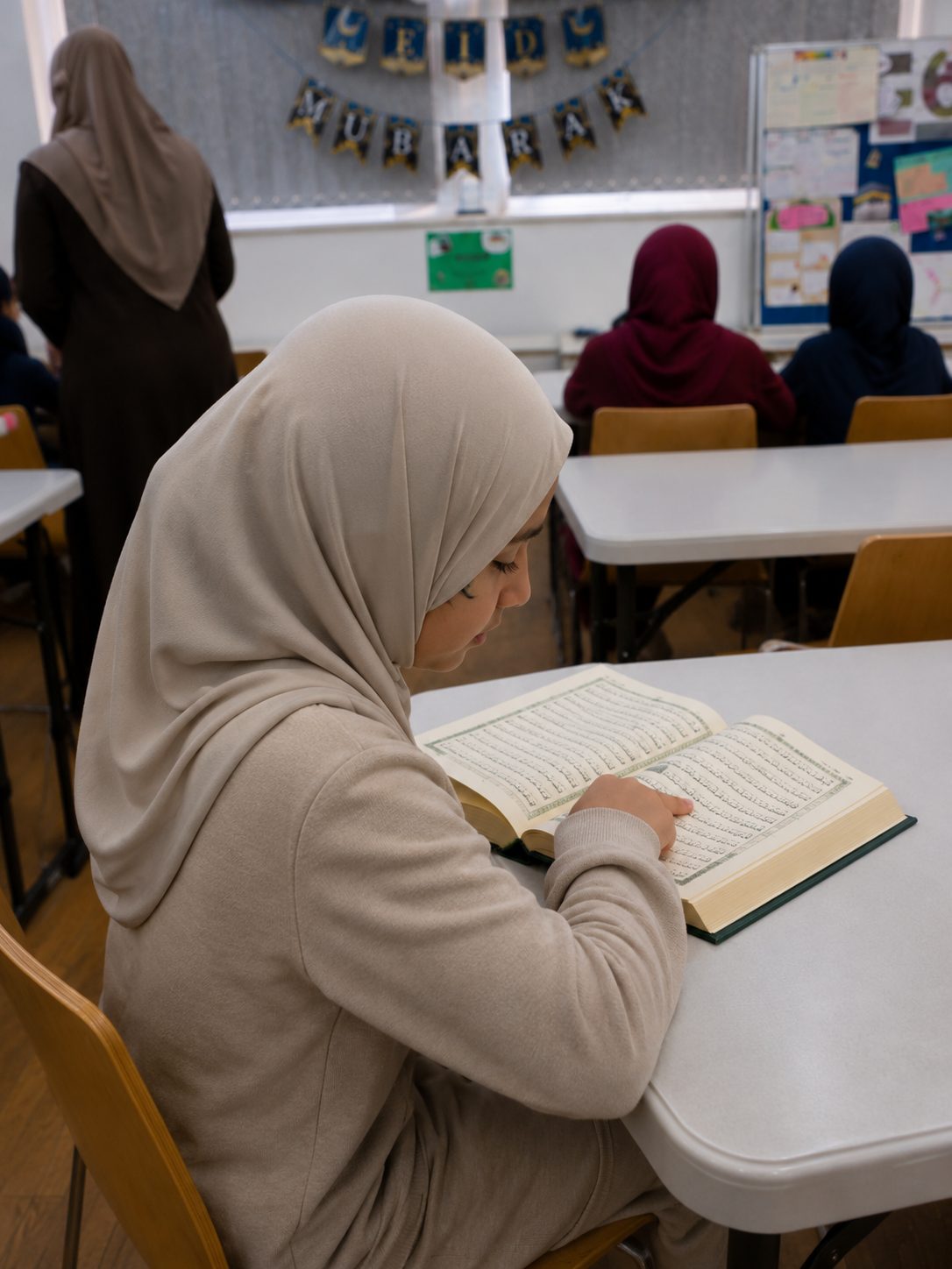 Children learning the Qur'an in a warm classroom at Makkah Centre
